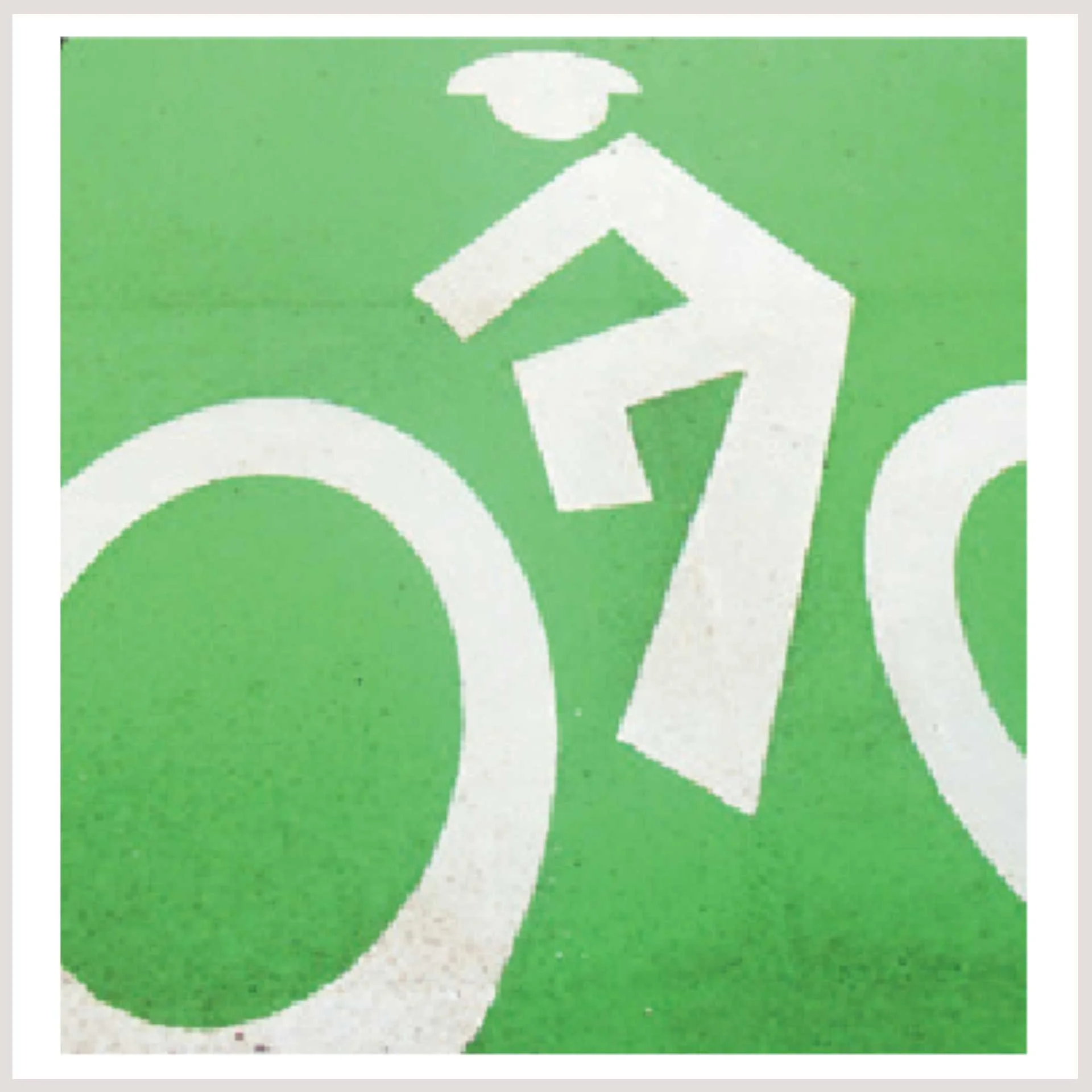 A green sign marking a bicycle path