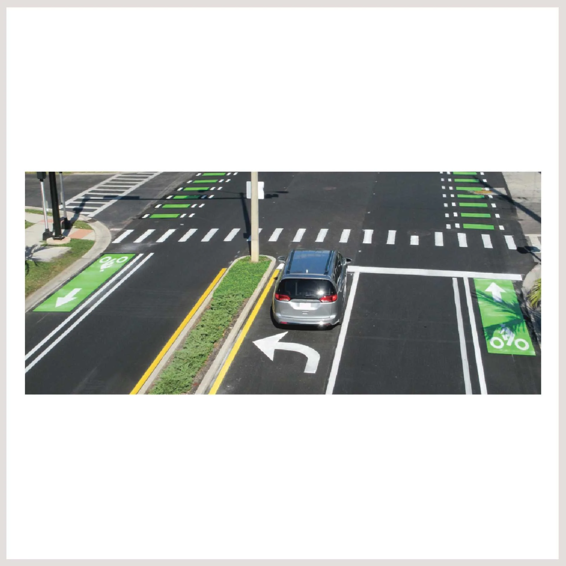 A solitary car parked on a road, occupying the central lane with no traffic around it.