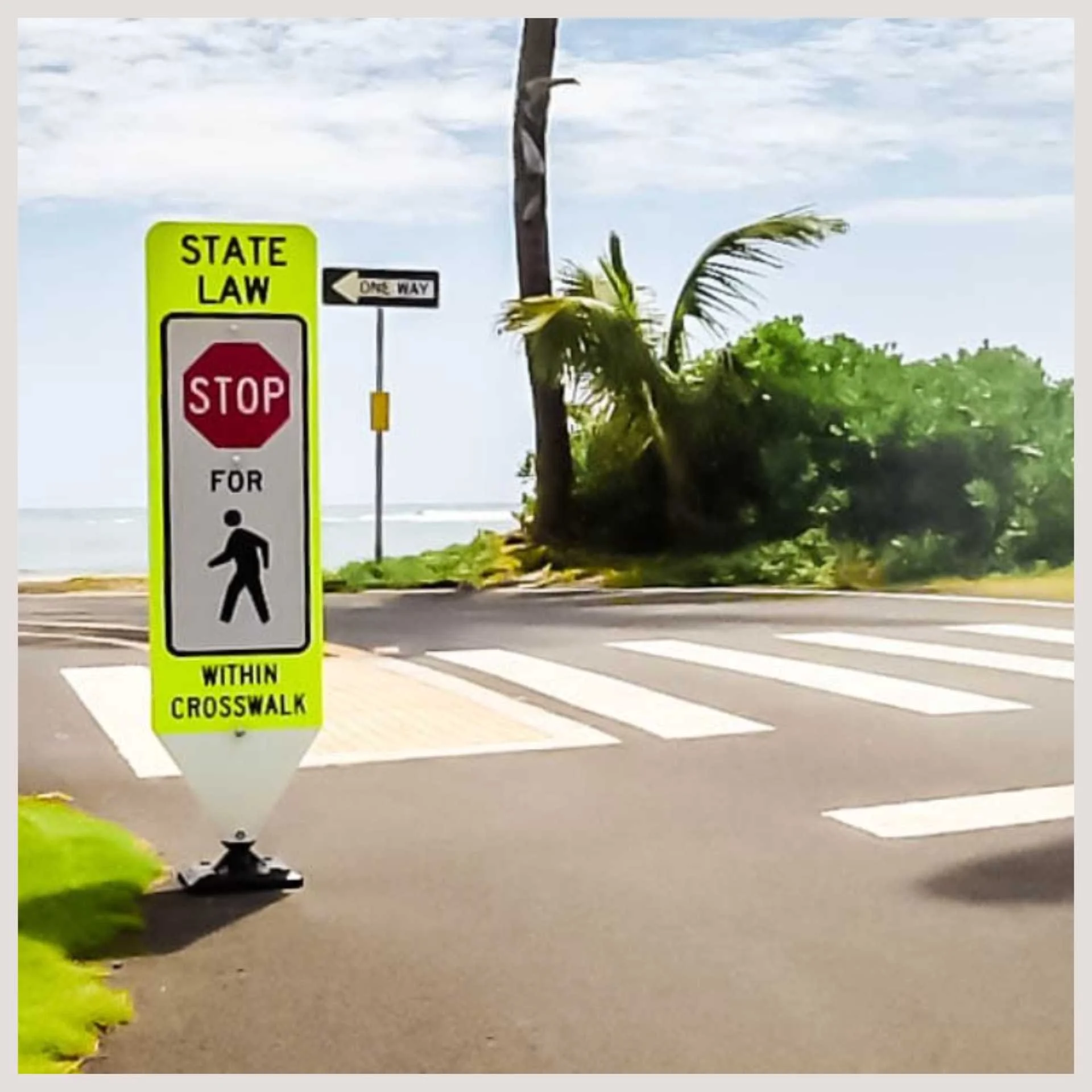 A red stop sign positioned on the side of a road, signaling drivers to halt before proceeding.