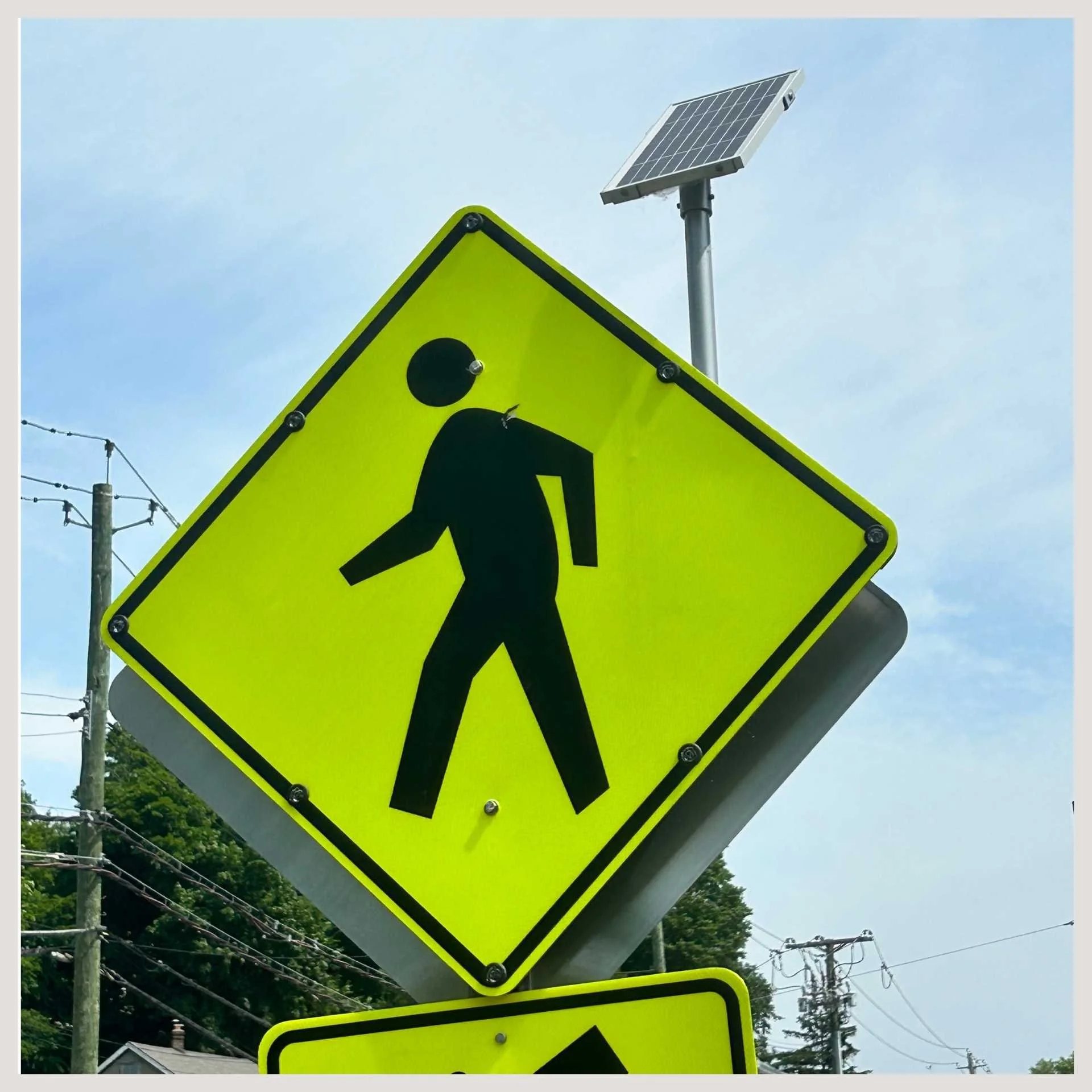 A yellow and black sign displayed prominently, conveying important information or warnings in a clear and visible manner.