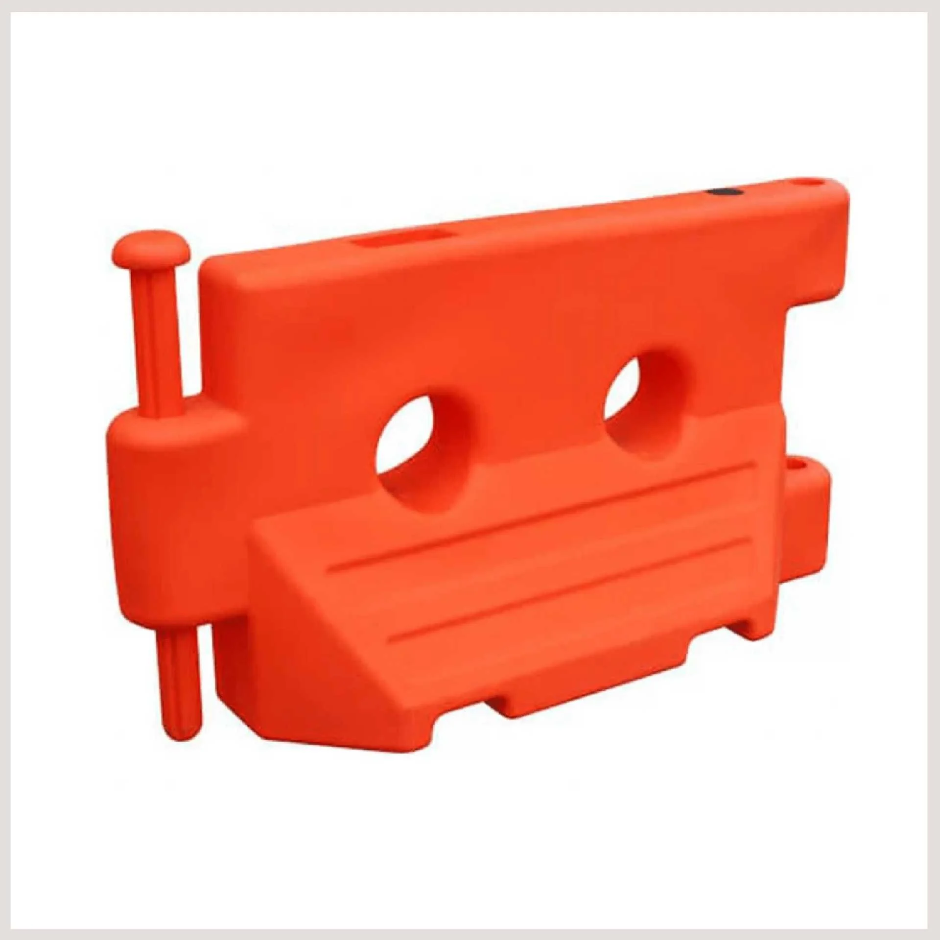 An orange plastic barrier featuring two circular holes