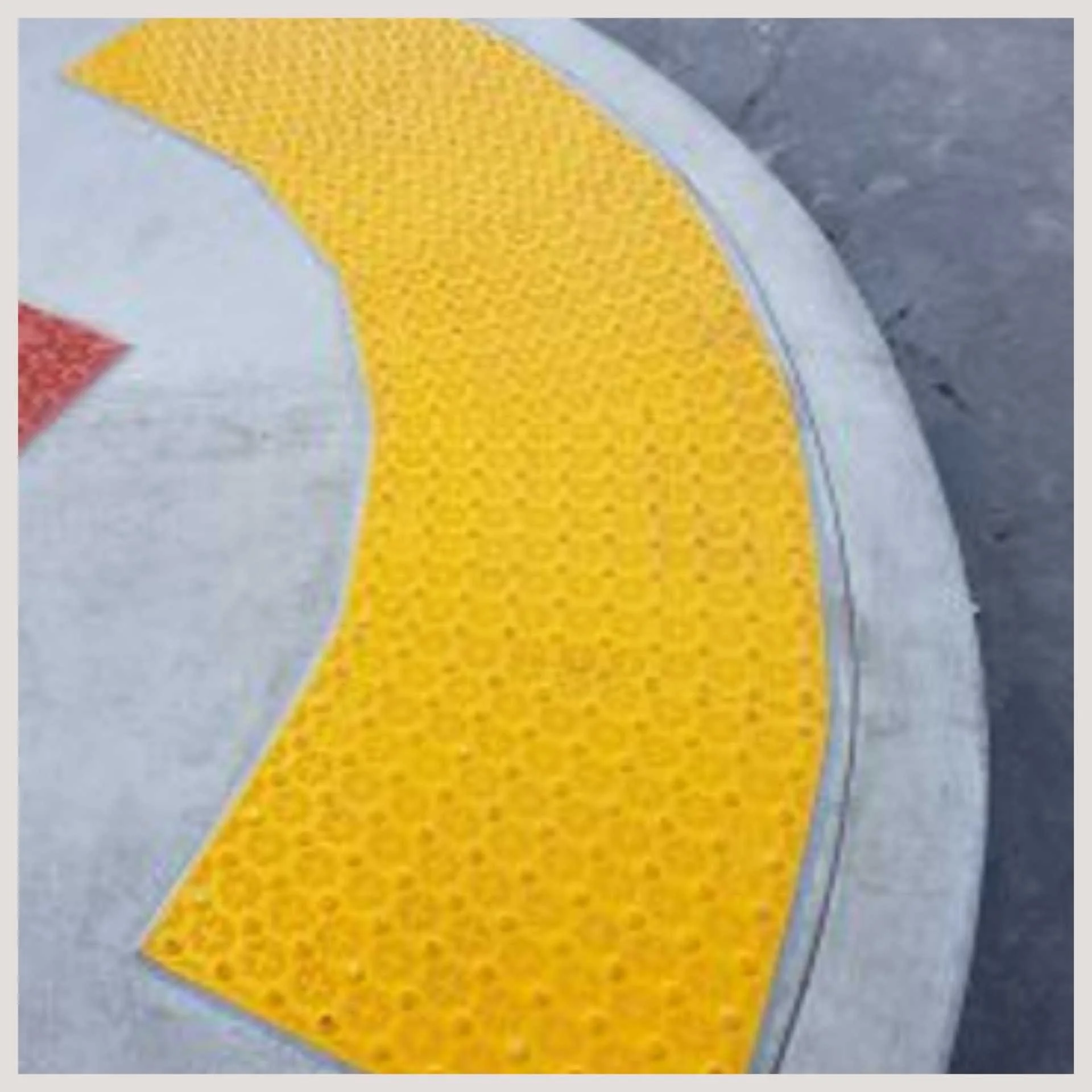 curved road with tactile warning plates