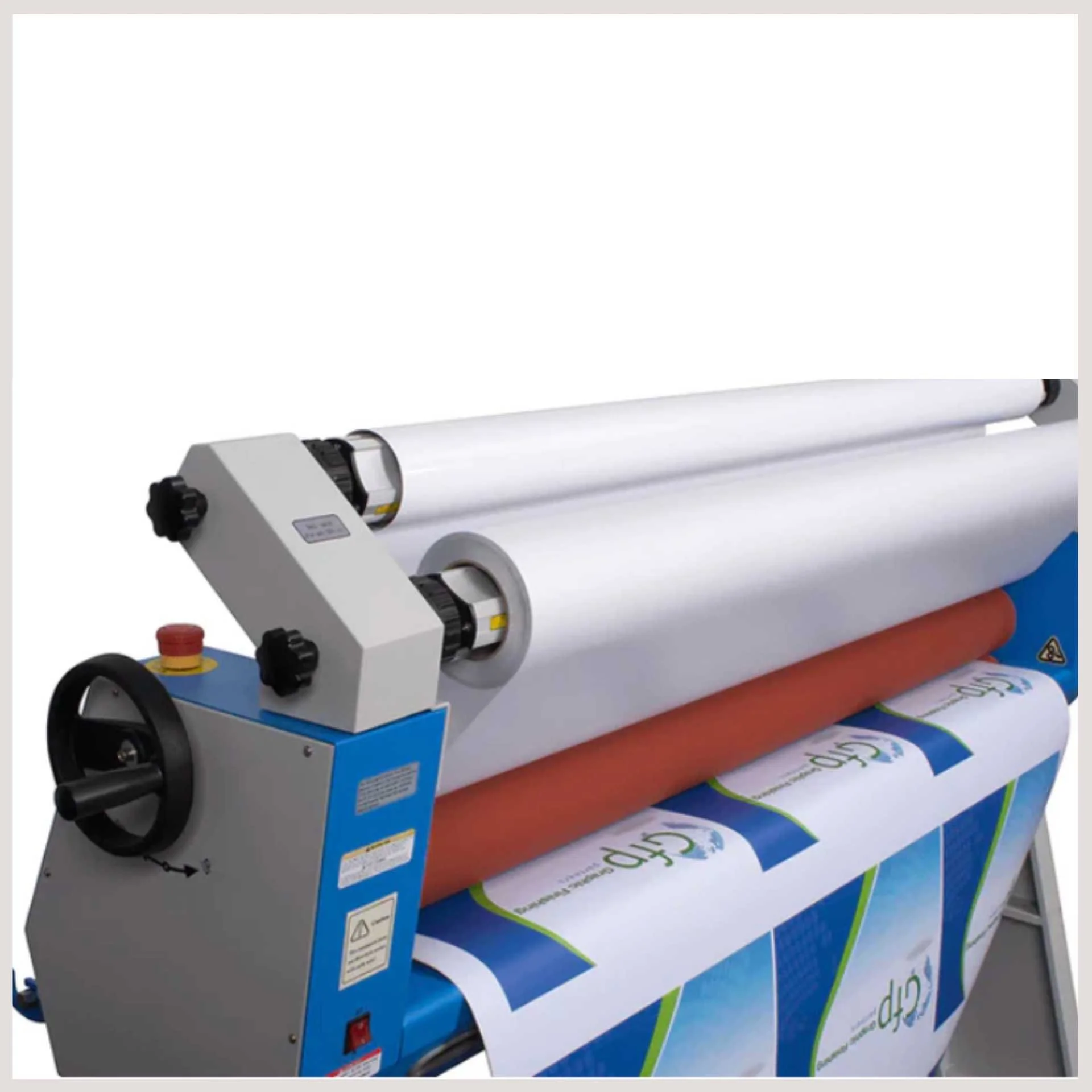 A large roll of paper positioned on a cold laminating machine, ready for processing and finishing applications.