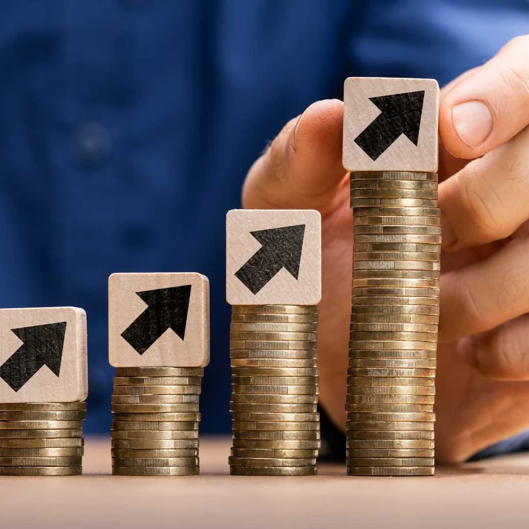 image with coins and arrows displaying rising costs